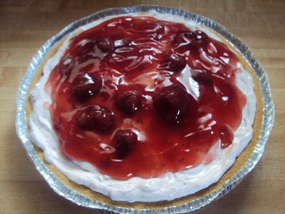 Cream cheese, sour cream, sugar and vanilla are whipped together to make a delicious no-bake cheesecake that is swirled with strawberries!